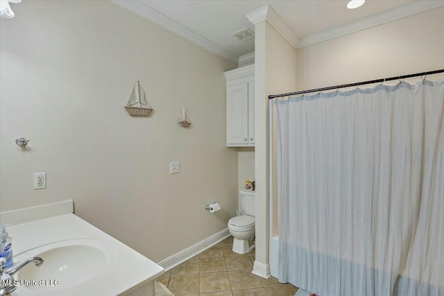 bathroom with tile patterned floors, crown molding, vanity, and toilet