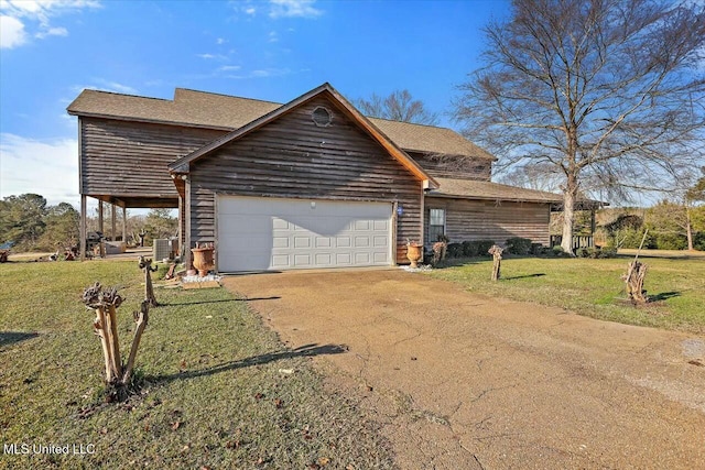 view of front of property with a garage and a front yard