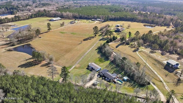 birds eye view of property featuring a rural view and a water view