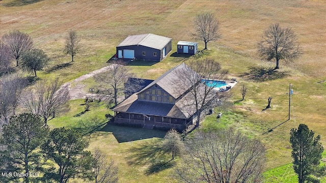 birds eye view of property with a rural view