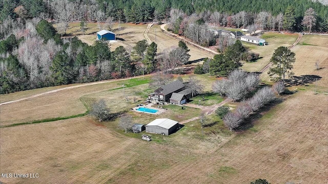 birds eye view of property with a rural view