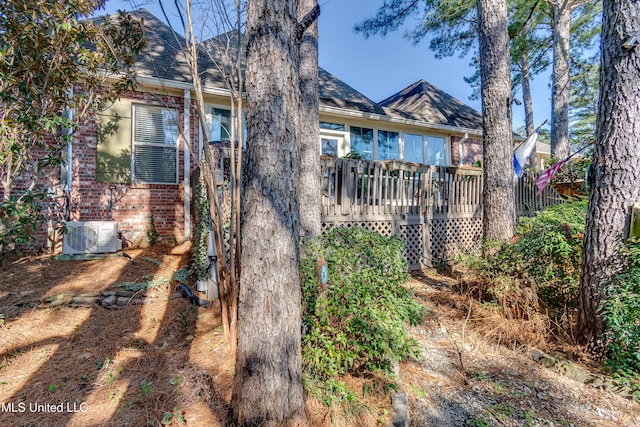 107 Hawks Nest Blf, Ridgeland, MS 39157 - rear view of property featuring brick siding, a deck, and central AC unit