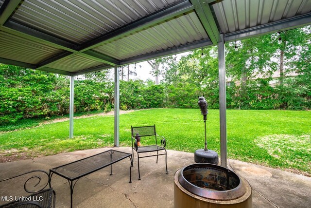 view of patio / terrace with a fire pit
