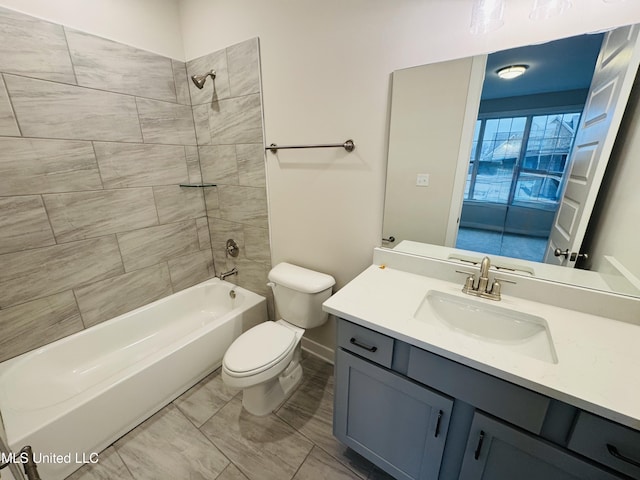 full bathroom featuring toilet, vanity, bathtub / shower combination, marble finish flooring, and baseboards