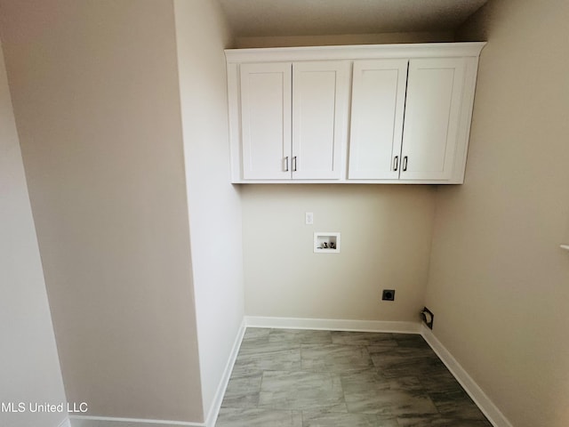 washroom featuring washer hookup, hookup for an electric dryer, baseboards, cabinet space, and marble finish floors