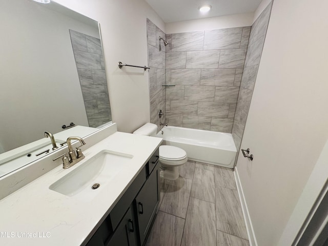 bathroom with toilet, vanity, and bathing tub / shower combination