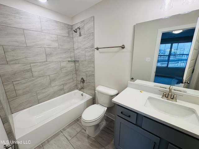full bathroom with toilet, vanity, and washtub / shower combination