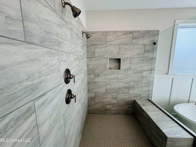 bathroom with a tile shower