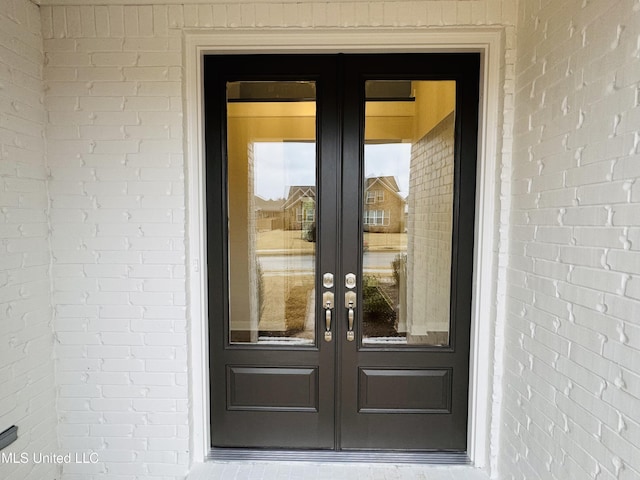 property entrance featuring french doors