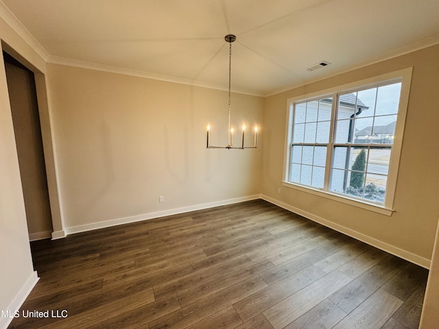 unfurnished dining area with ornamental molding, a chandelier, dark wood finished floors, and baseboards