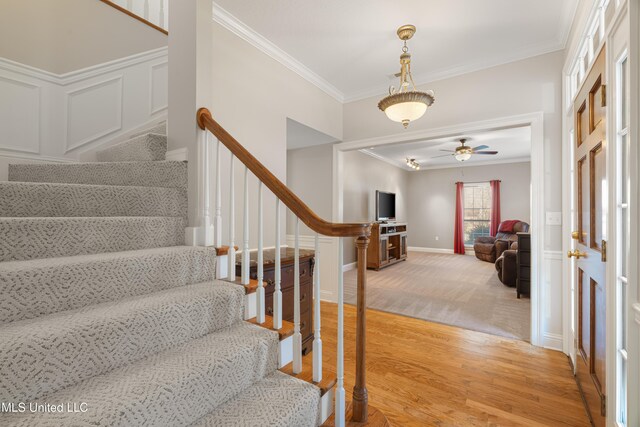 95 Sweet Bay Trl, Petal, MS 39465 - stairway featuring ornamental molding, wood finished floors, baseboards, ceiling fan, and carpet flooring