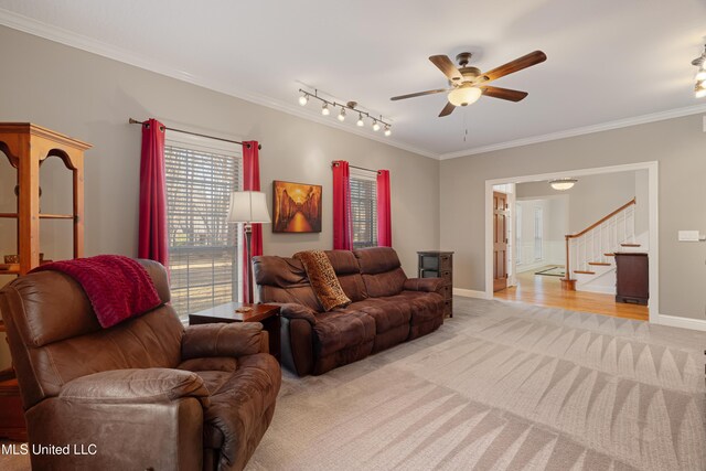 95 Sweet Bay Trl, Petal, MS 39465 - living room featuring light colored carpet, ceiling fan, ornamental molding, baseboards, and stairway