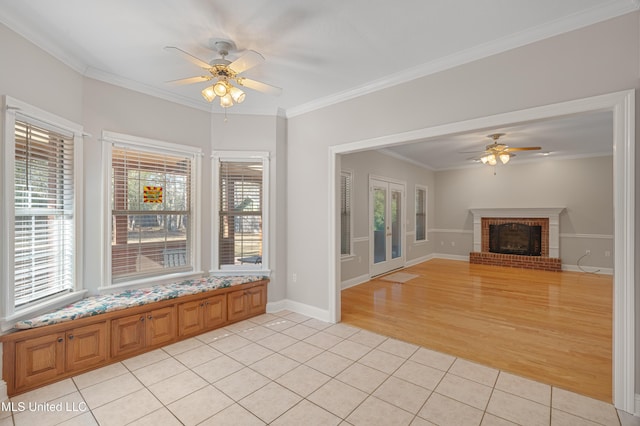 95 Sweet Bay Trl, Petal, MS 39465 - unfurnished living room featuring a ceiling fan, light tile patterned floors, ornamental molding, a fireplace, and baseboards