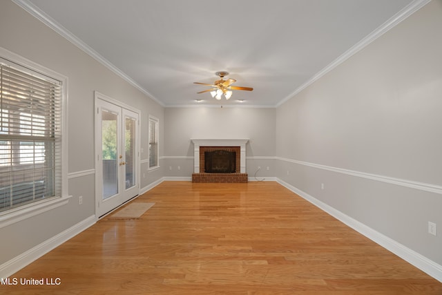 95 Sweet Bay Trl, Petal, MS 39465 - unfurnished living room featuring ceiling fan, a brick fireplace, french doors, light wood finished floors, and baseboards