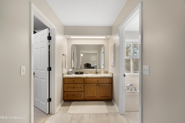 95 Sweet Bay Trl, Petal, MS 39465 - bathroom featuring vanity, baseboards, and a garden tub