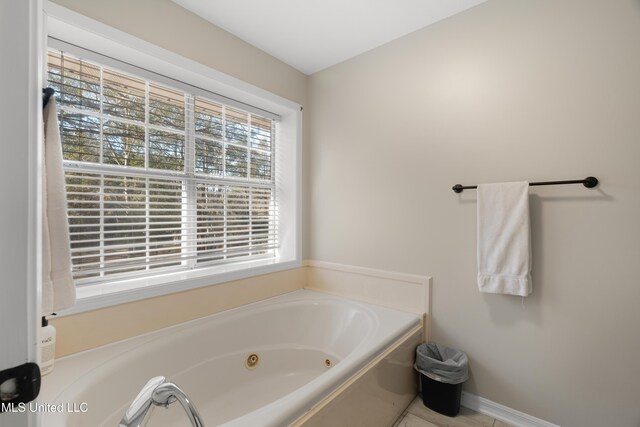 95 Sweet Bay Trl, Petal, MS 39465 - bathroom featuring a jetted tub and baseboards