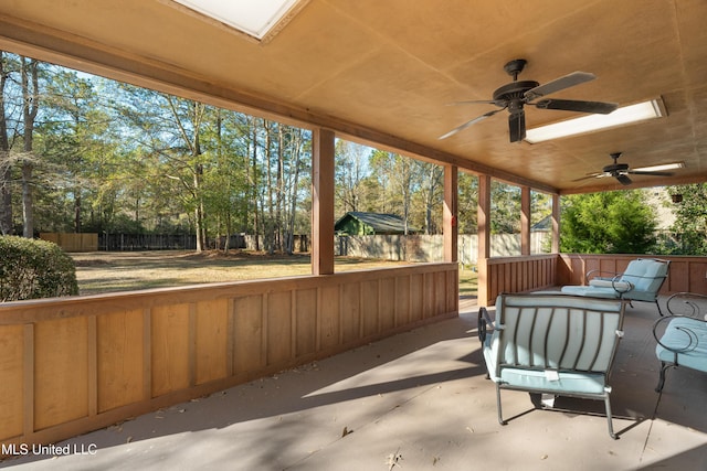 95 Sweet Bay Trl, Petal, MS 39465 - fenced backyard featuring a ceiling fan, a patio area, view of scattered trees, and an outdoor living space