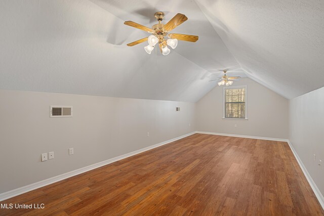 95 Sweet Bay Trl, Petal, MS 39465 - additional living space featuring vaulted ceiling, wood finished floors, a ceiling fan, and baseboards