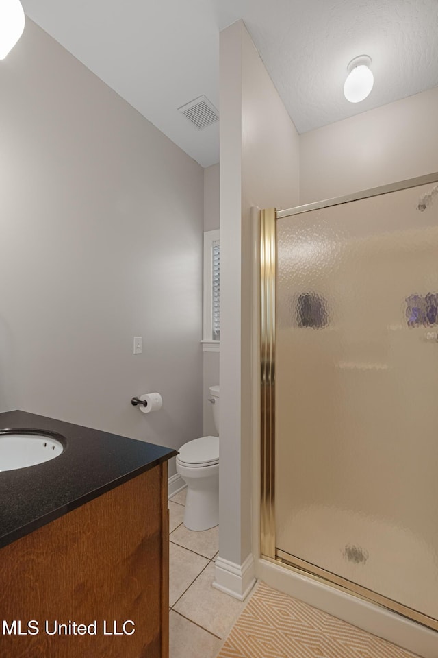 95 Sweet Bay Trl, Petal, MS 39465 - full bath featuring tile patterned flooring, a stall shower, vanity, toilet, and baseboards