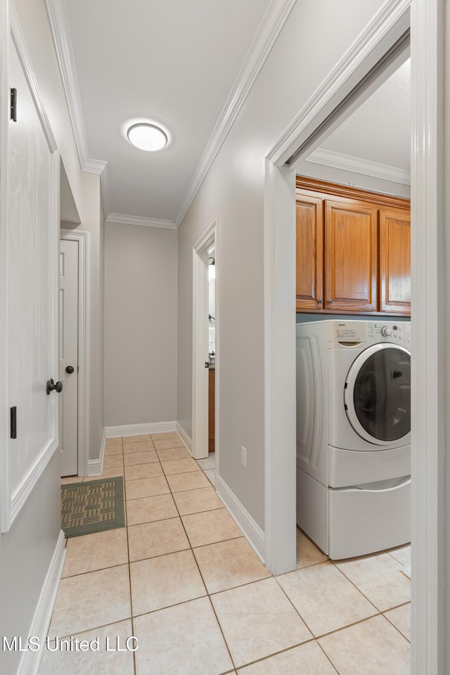 95 Sweet Bay Trl, Petal, MS 39465 - laundry area with cabinet space, crown molding, light tile patterned floors, washer / clothes dryer, and baseboards