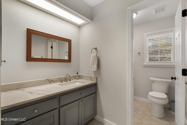 95 Sweet Bay Trl, Petal, MS 39465 - bathroom featuring vanity, toilet, baseboards, and tile patterned floors