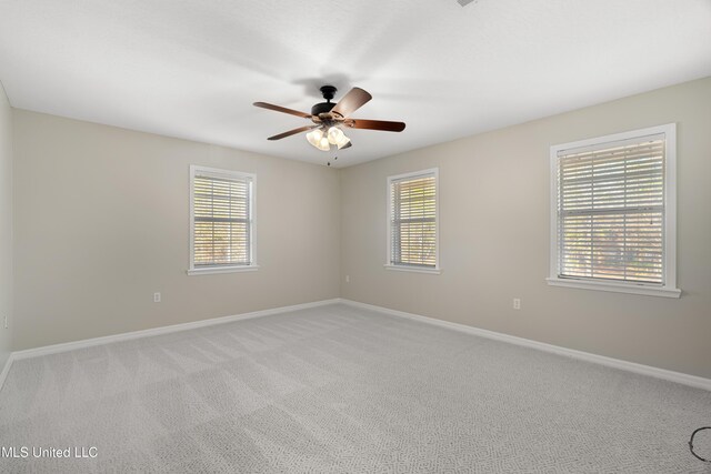 95 Sweet Bay Trl, Petal, MS 39465 - empty room with healthy amount of natural light, light carpet, ceiling fan, and baseboards