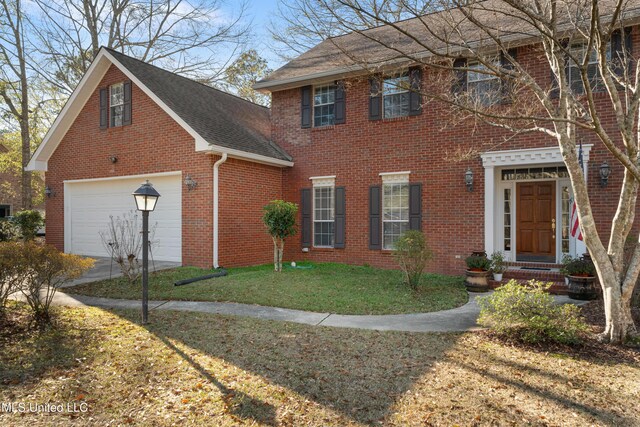 95 Sweet Bay Trl, Petal, MS 39465 - view of front facade with brick siding, a garage, a shingled roof, a front yard, and driveway