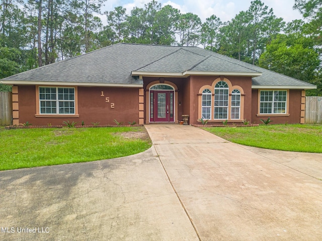 152 Sycamore Dr, Pass Christian, MS 39571 - ranch-style house featuring a shingled roof, stucco siding, and concrete driveway