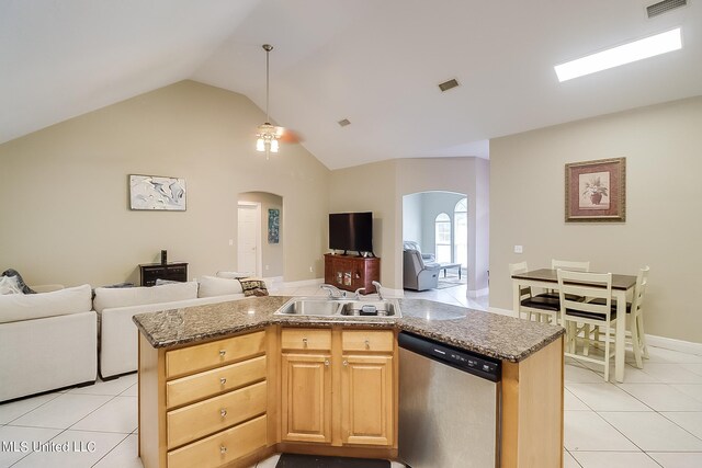 152 Sycamore Dr, Pass Christian, MS 39571 - kitchen with stainless steel dishwasher, arched walkways, open floor plan, a sink, and light tile patterned floors