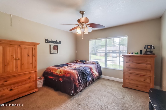 152 Sycamore Dr, Pass Christian, MS 39571 - bedroom with light colored carpet, baseboards, and ceiling fan
