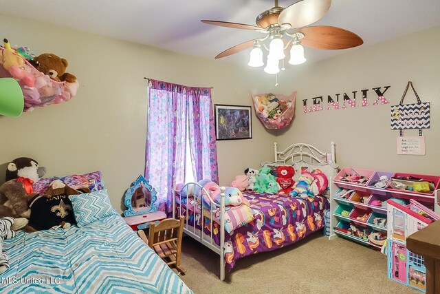 152 Sycamore Dr, Pass Christian, MS 39571 - bedroom with carpet floors and ceiling fan
