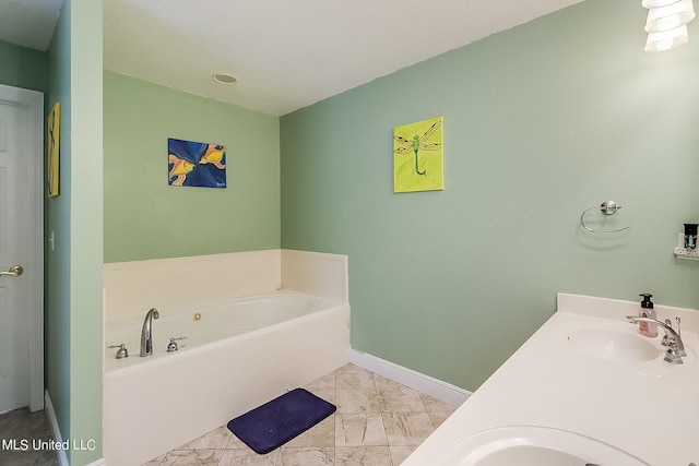 152 Sycamore Dr, Pass Christian, MS 39571 - full bathroom with a sink, a garden tub, baseboards, and marble look tile flooring