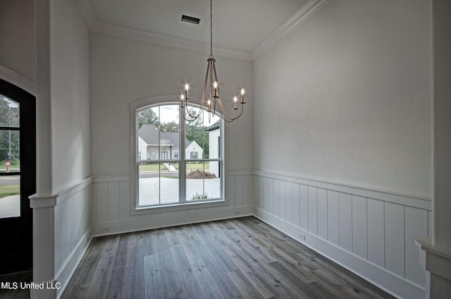 100 Grayson Way, Madison, MS 39110 - unfurnished dining area featuring wainscoting, wood finished floors, a notable chandelier, and ornamental molding