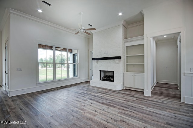 100 Grayson Way, Madison, MS 39110 - unfurnished living room with crown molding, a ceiling fan, a large fireplace, and visible vents