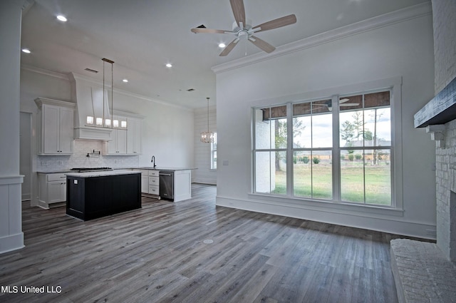 100 Grayson Way, Madison, MS 39110 - kitchen with stainless steel dishwasher, crown molding, light countertops, a kitchen island, and ceiling fan with notable chandelier