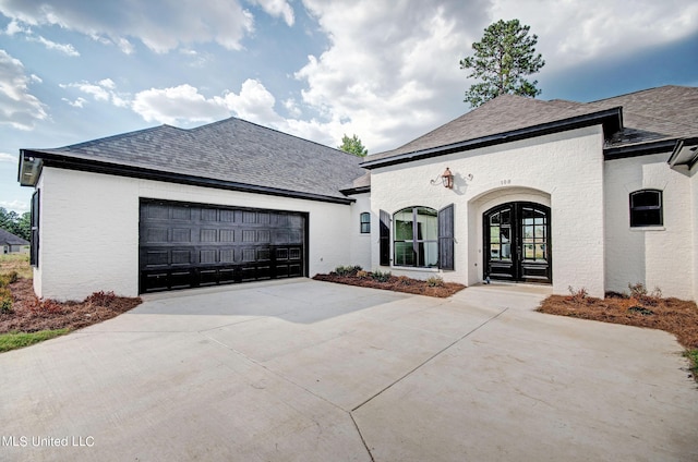 100 Grayson Way, Madison, MS 39110 - view of front of property with driveway, a shingled roof, brick siding, and a garage