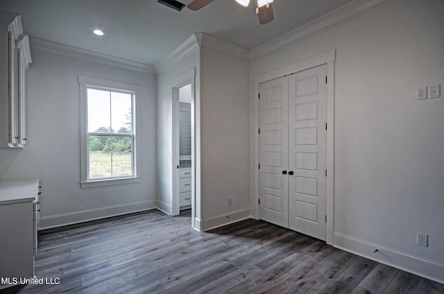 100 Grayson Way, Madison, MS 39110 - unfurnished bedroom featuring crown molding, ceiling fan, a closet, baseboards, and dark wood-style flooring