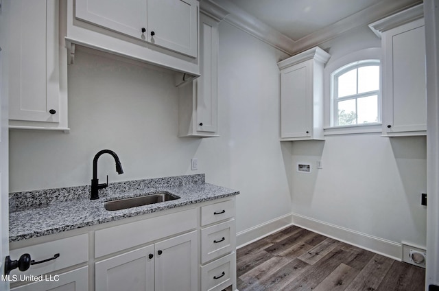 100 Grayson Way, Madison, MS 39110 - clothes washing area featuring crown molding, a sink, baseboards, hookup for a washing machine, and dark wood-type flooring