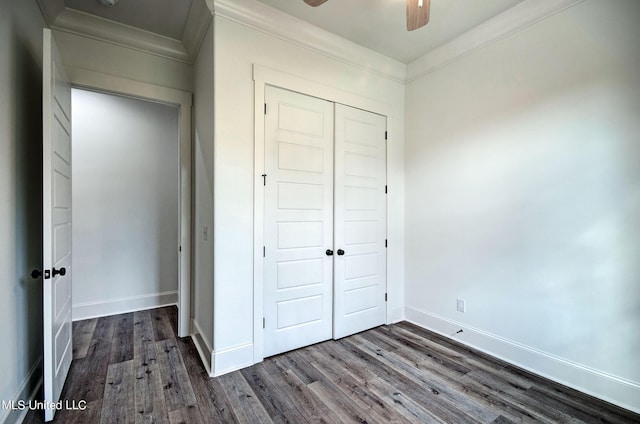 100 Grayson Way, Madison, MS 39110 - unfurnished bedroom featuring dark wood-style floors, baseboards, ornamental molding, and a closet