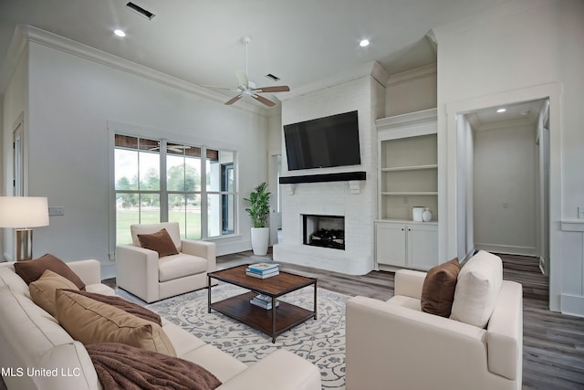 100 Grayson Way, Madison, MS 39110 - living area featuring visible vents, wood finished floors, ceiling fan, and crown molding
