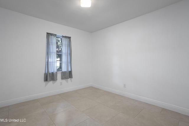 view of tiled spare room