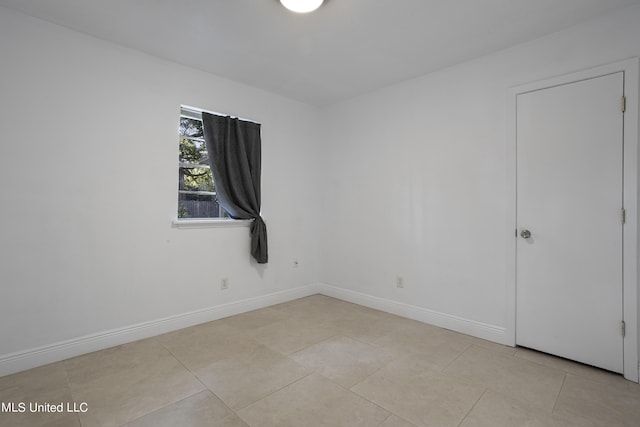 view of tiled spare room