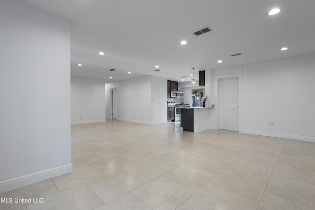 unfurnished living room with light tile patterned floors