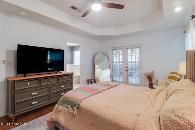 bedroom with french doors, visible vents, a raised ceiling, and ornamental molding