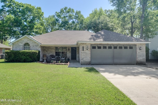single story home with an attached garage, brick siding, driveway, and a front yard