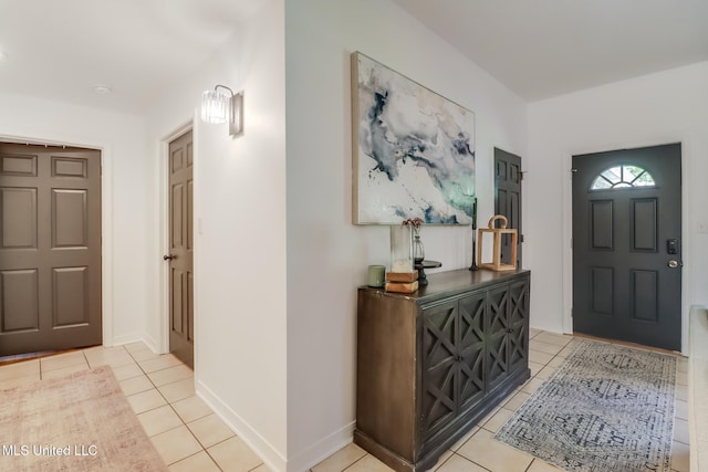 foyer entrance featuring light tile patterned floors