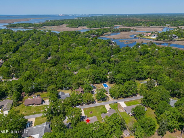 aerial view with a wooded view and a water view