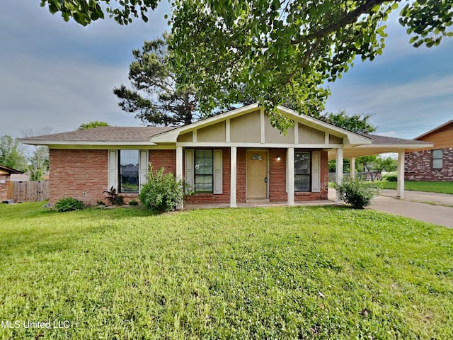 10482 Lafayette Dr, Olive Branch, MS 38654 - view of front of house with brick siding, concrete driveway, a carport, and a porch