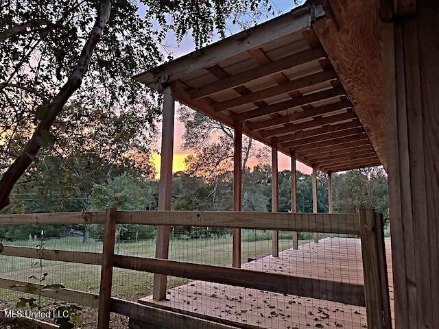deck at dusk with fence