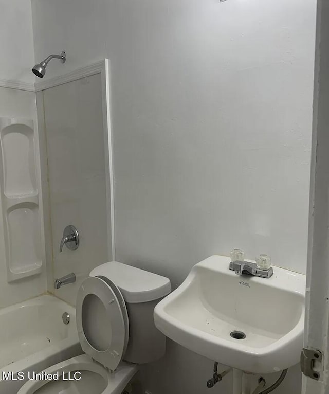 full bathroom with toilet, sink, and shower / bathing tub combination